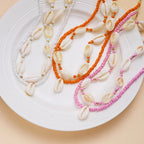 Double cowrie shell necklace red