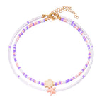 Double shell necklace and pink colored beads