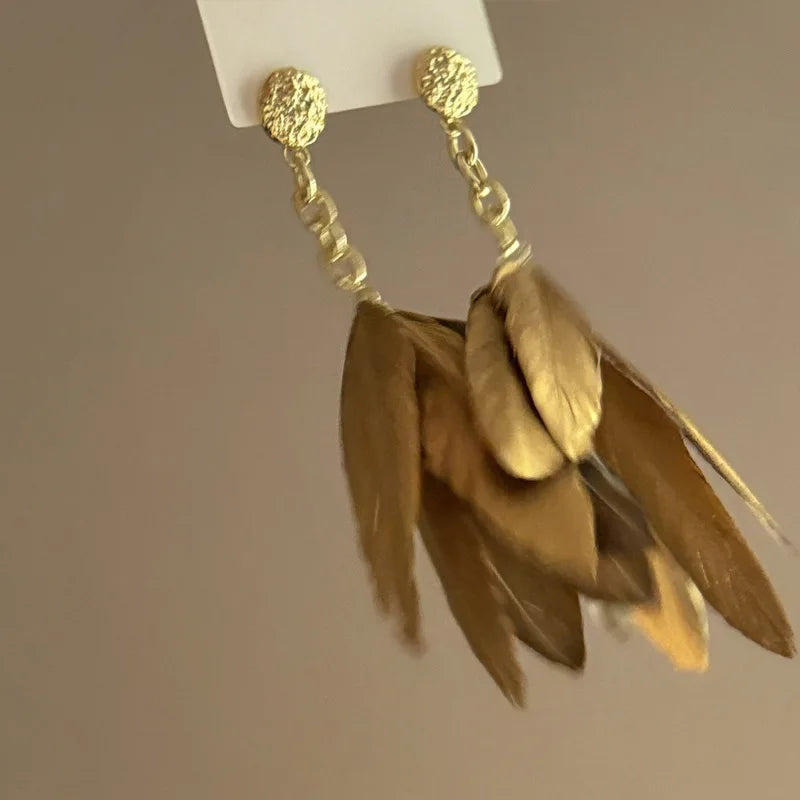 Large gold feather earrings