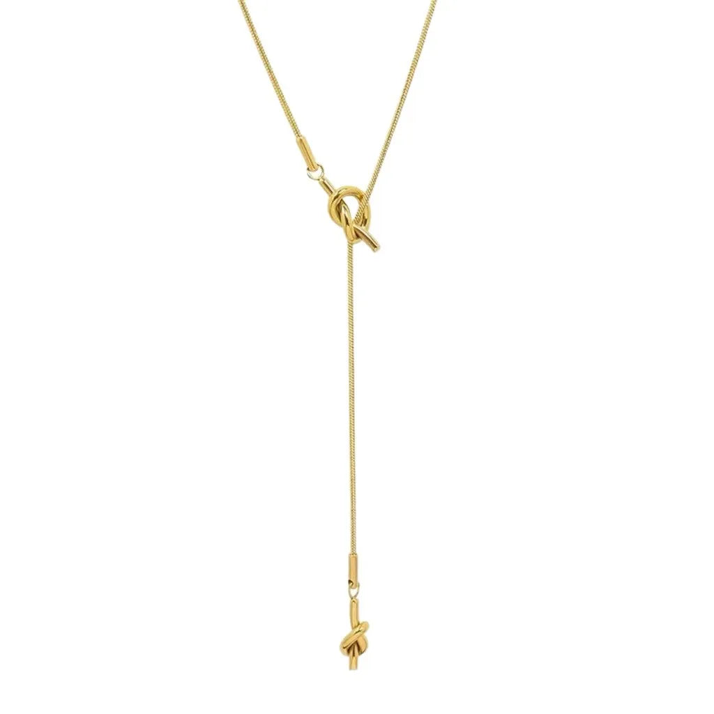 Necklace with bow pendant design gold