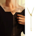 Necklace with bow pendant gold