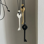 Long rope necklace with black key pendant