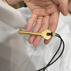 Long rope necklace with gold key pendant