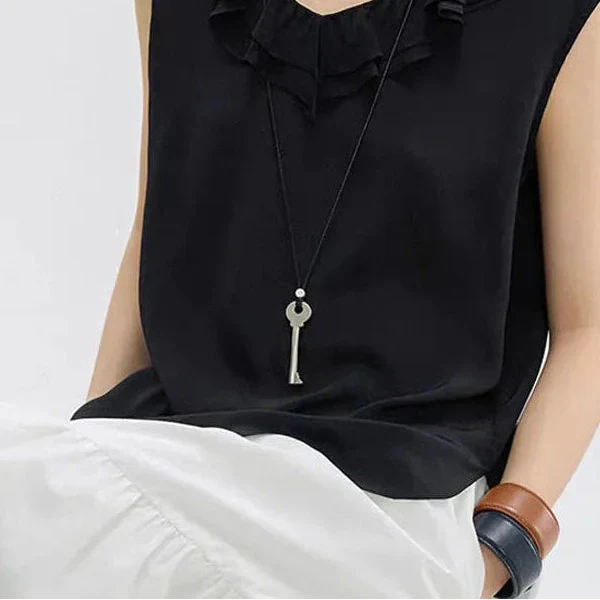 Long rope necklace with matte silver key pendant