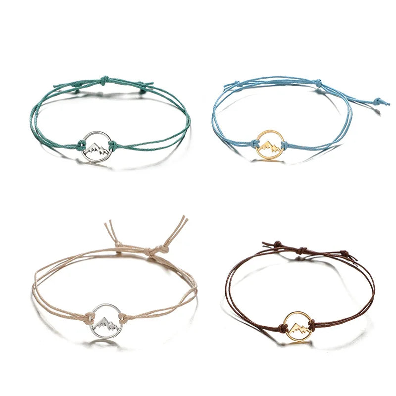 Set of 4 Cord Bracelets with Round Mountain Pendant