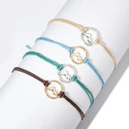 Set of 4 Cord Bracelets with Round Mountain Pendant