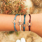 Set of 4 Cord Bracelets with Round Mountain Pendant