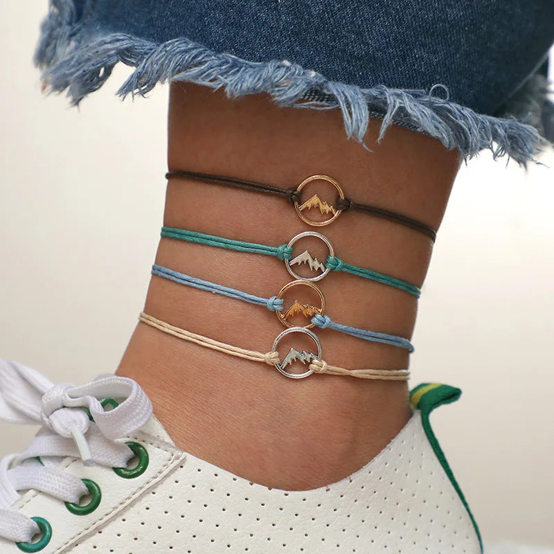 Set of 4 Cord Bracelets with Round Mountain Pendant