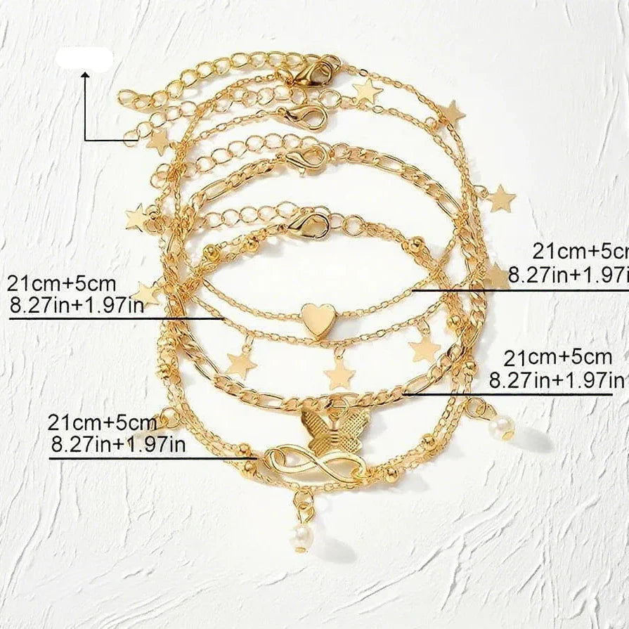 Set of 5 anklets: star, infinity, butterfly, beads, and heart