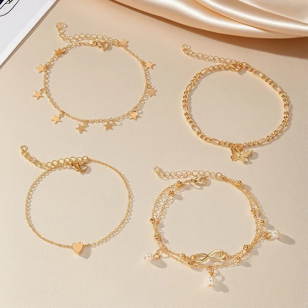 Set of 5 anklets: star, infinity, butterfly, beads, and heart