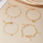 Set of 5 anklets: star, infinity, butterfly, beads, and heart